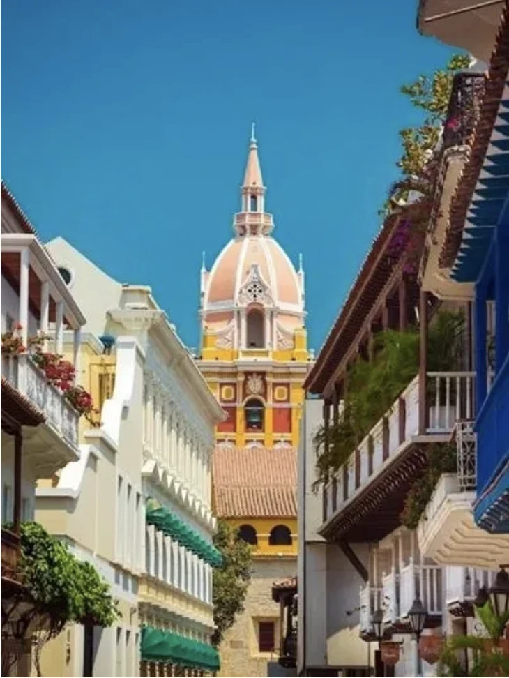 Colorful Cartagena street view for Colombia wellness retreat led by Beatriz Martinez, Miami psychotherapist.