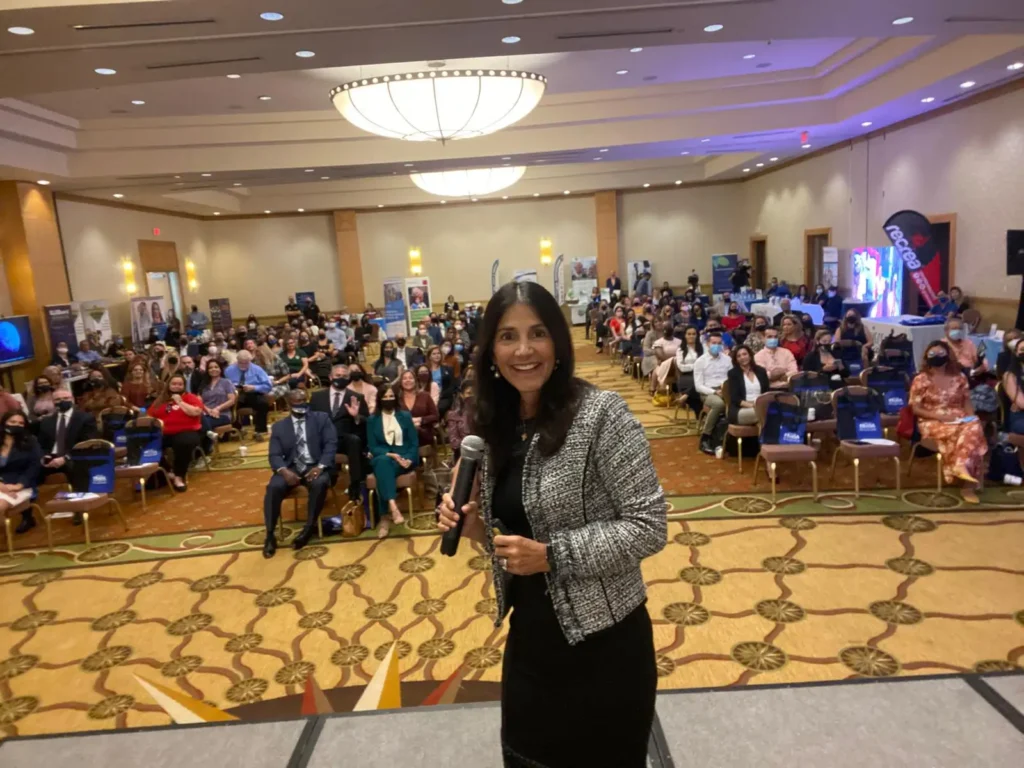 Beatriz Martinez-Peñalver mental health counselor and Triumph Steps creator speaking at Miami conference event.