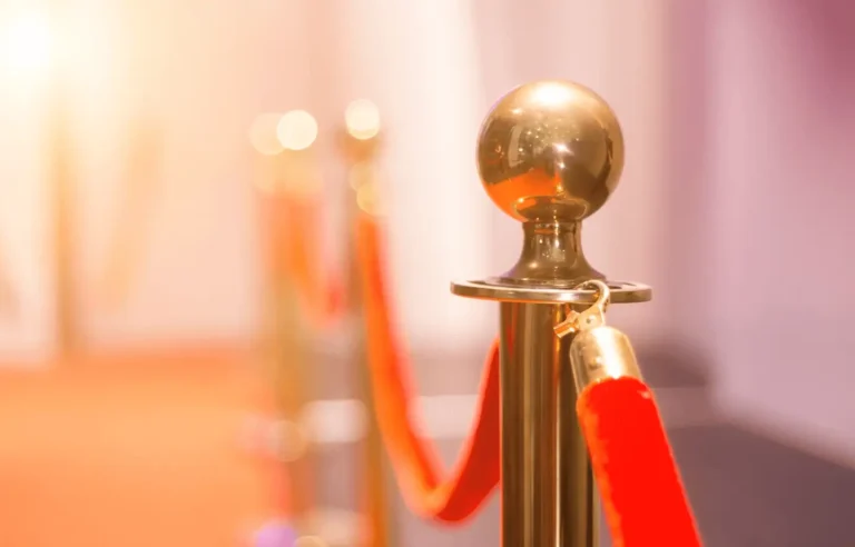 VIP red carpet barrier symbolizing exclusive success coaching in Miami by Beatriz Martinez-Peñalver.