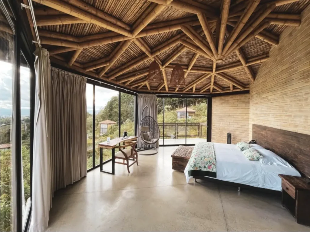Luxury mountain-view bedroom at Colombia mental wellness retreat led by Beatriz Martinez, Miami psychotherapist.