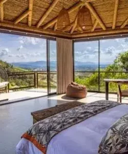 Luxury mountain-view room in Colombia wellness retreat led by Beatriz Martinez, Miami psychotherapist.
